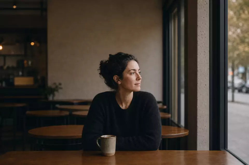 Woman centered in a cafe while looking right